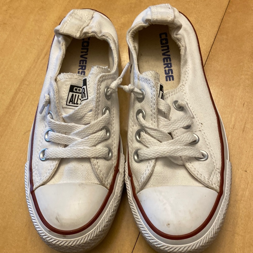 White Converse slip-on sneakers